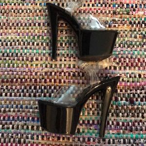 Pleaser 7 inch heels . Black with clear straps .